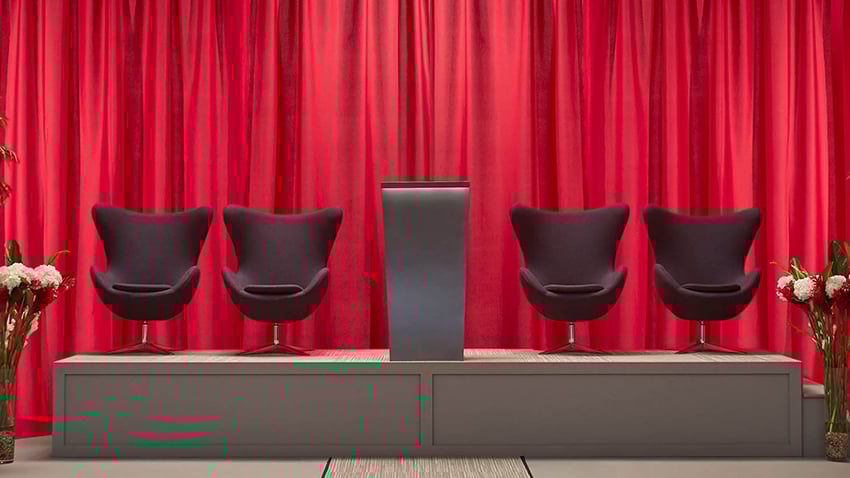 stage set with red poly premier drape